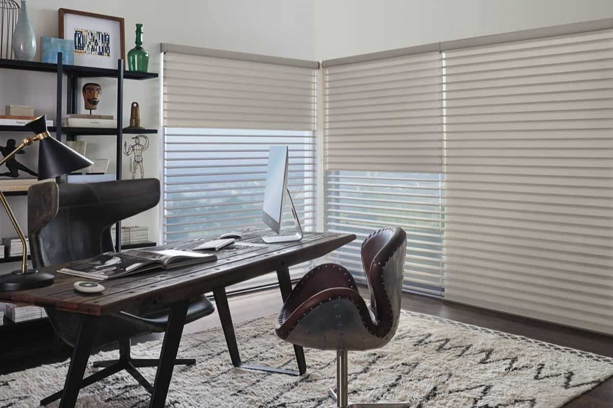 Hunter Douglas PowerView® Automation installed on window treatments in a home office