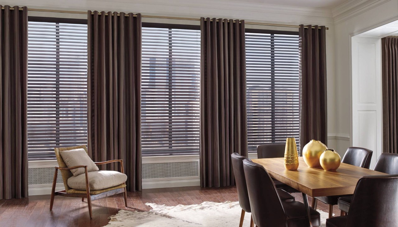 Apartment dining room outfitted with Hunter Douglas shutters and curtains near Monroeville, PA