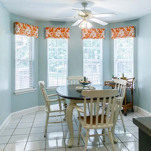 Light Blue Eat-In Dining Room next to the kitchen with a tile floor, table and chairs